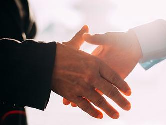 Two men shaking hands on a deal